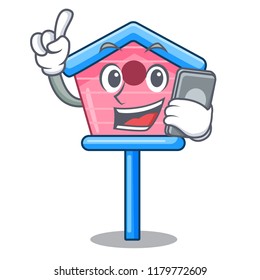 With phone cartoon little bird house in spring