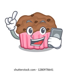 With phone chocolate muffins on cartoon cake paper