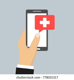 phone in hand medical aid on a gray background