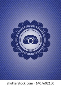 phone icon inside badge with jean texture