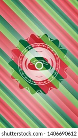 phone icon inside christmas colors badge.