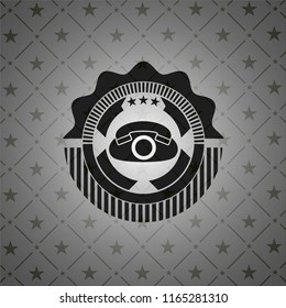 phone icon inside dark emblem
