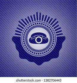 phone icon inside emblem with denim texture
