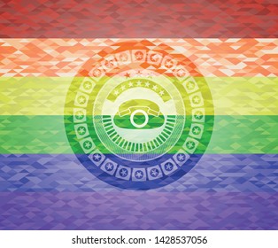 phone icon inside emblem on mosaic background with the colors of the LGBT flag