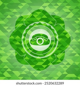 phone icon inside green emblem with mosaic ecological style background. 