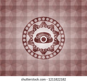 phone icon inside red emblem with geometric pattern background. Seamless.