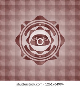 phone icon inside red seamless geometric emblem.