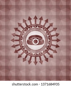 phone icon inside red seamless emblem or badge with geometric pattern background.