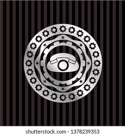 phone icon inside silvery emblem or badge