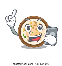 With phone Samgyetang served in hot cartoon bowl
