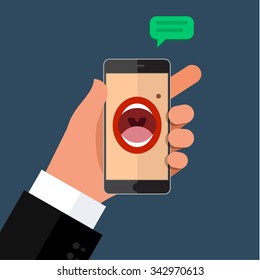 Phone speak concept. Man holding his hand phone with speaking woman's mouth in display.