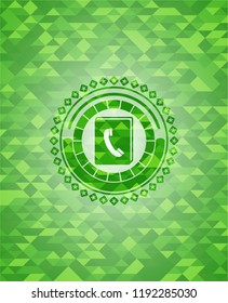 phonebook icon inside realistic green mosaic emblem