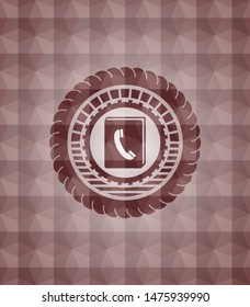 phonebook icon inside red emblem or badge with abstract geometric polygonal pattern background. Seamless.