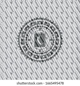 phonebook icon inside silver badge or emblem. Scales pattern. Vector Illustration. Detailed.