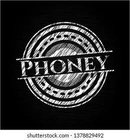 Phoney chalkboard emblem written on a blackboard