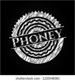 Phoney written on a chalkboard
