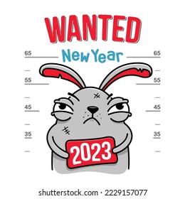 Photo bad rabbit poster    Wanted New Year  holding sign in his hands 2023 symbol the holiday  New Year concept for card banner 