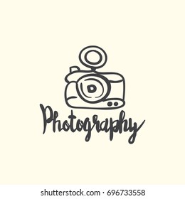 photo camera hand drawn icon with lines and lettering design on background. graphic vector illustration