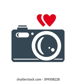 Photo camera with heart. Vector icon. Color illustration.