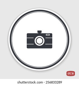 Photo camera icon. Flat design style. Made vector illustration. Emblem or label with shadow.