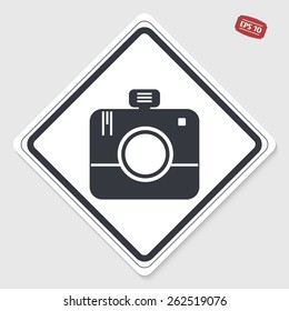 Photo camera icon. Flat design style. Made vector illustration. Emblem or label with shadow.