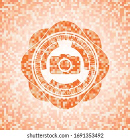 photo camera icon inside abstract emblem, orange mosaic background