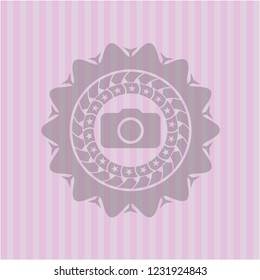 photo camera icon inside badge with pink background