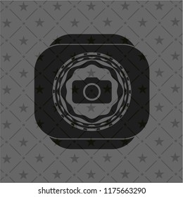 photo camera icon inside black emblem