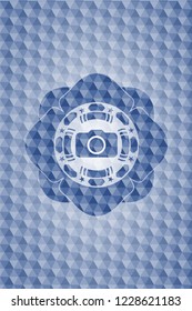 photo camera icon inside blue emblem or badge with abstract geometric polygonal pattern background.