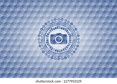photo camera icon inside blue emblem with geometric pattern background.