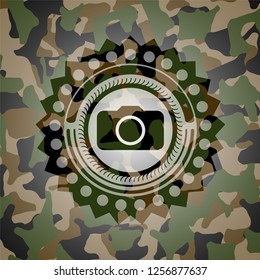 photo camera icon inside camo emblem