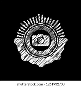 photo camera icon inside chalk emblem