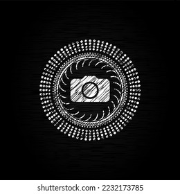 photo camera icon inside chalk emblem. 