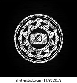 photo camera icon inside chalkboard emblem