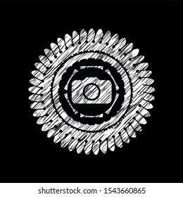 photo camera icon inside chalkboard emblem on black board