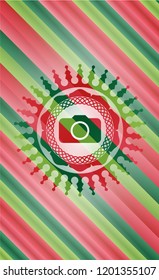 photo camera icon inside christmas emblem background.