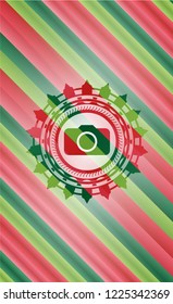 photo camera icon inside christmas emblem background.