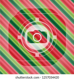photo camera icon inside christmas emblem background.
