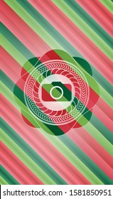 photo camera icon inside christmas badge.