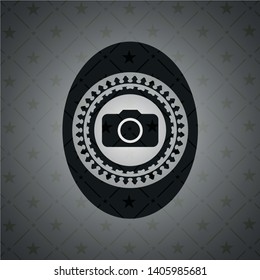 photo camera icon inside dark badge or emblem