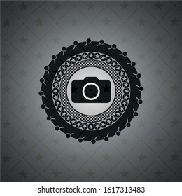 photo camera icon inside dark emblem