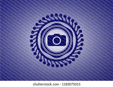 photo camera icon inside denim background