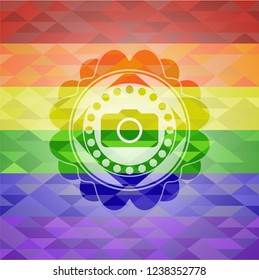 photo camera icon inside emblem on mosaic background with the colors of the LGBT flag