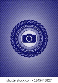 photo camera icon inside emblem with denim high quality background