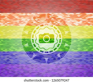 photo camera icon inside emblem on mosaic background with the colors of the LGBT flag