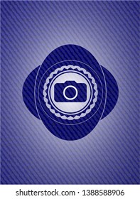 photo camera icon inside emblem with jean texture