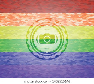 photo camera icon inside emblem on mosaic background with the colors of the LGBT flag