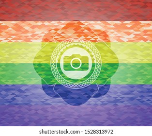 photo camera icon inside emblem on mosaic background with the colors of the LGBT flag