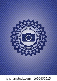 photo camera icon inside emblem with jean texture