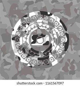 photo camera icon inside grey camouflaged emblem